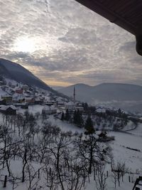 Scenic view of snowcapped mountains against sky during sunset