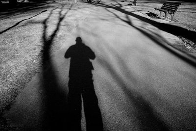 Shadow of man on street