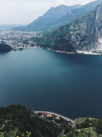 High angle view of buildings and sea against sky