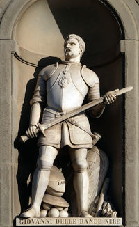 Low angle view of statue against building