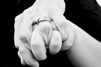 Cropped of couple holding hands