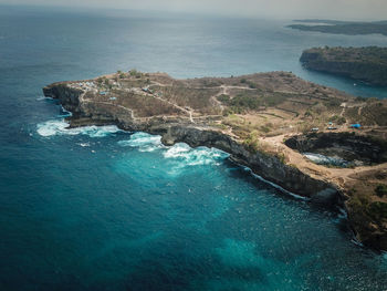 High angle view of rocks on sea