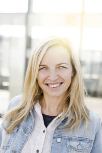 Portrait of smiling woman with blond hair