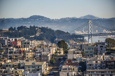 High angle view of bridge and buildings against sky