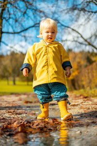 Portrait of boy standing on field