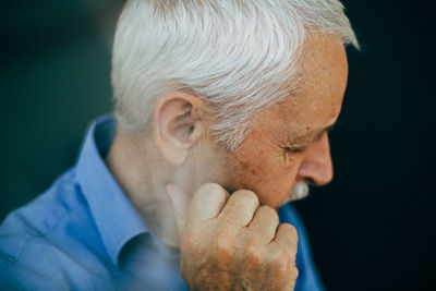 Close-up of man against gray background