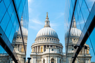 Low angle view of buildings against sky in city
