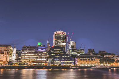 Illuminated buildings in city at night