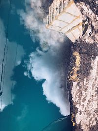 High angle view of building by sea against sky