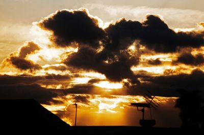 Low angle view of cloudy sky at sunset