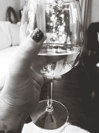 Close-up of hand holding glass of wine