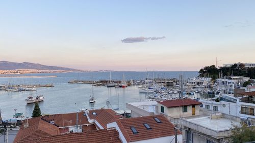 High angle view of harbor and buildings in city