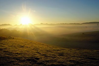 Bright sun shining over landscape