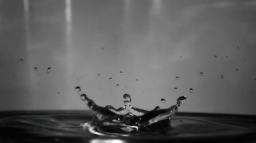 Close-up of water splashing against sky