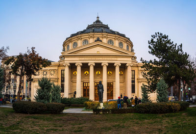 Facade of historic building against clear sky