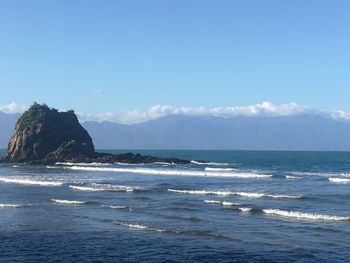 Scenic view of sea against blue sky