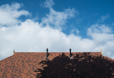 High section of building against cloudy sky