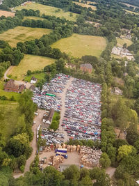 High angle view of trees and buildings in city