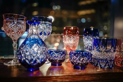 Close-up of various glasses on table