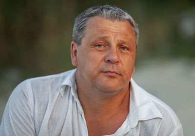 Close-up portrait of man wearing hat outdoors