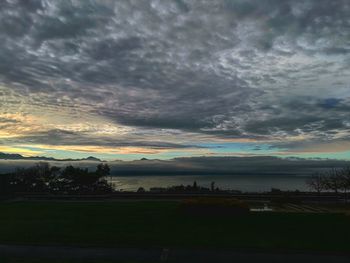 Scenic view of lake against dramatic sky