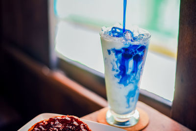 Close-up of drink served on table
