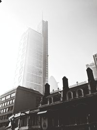 Low angle view of modern buildings against clear sky
