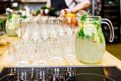 Citrus lemonade with lime, mint and ice on the bar counter