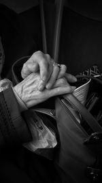 Cropped hand of man using mobile phone