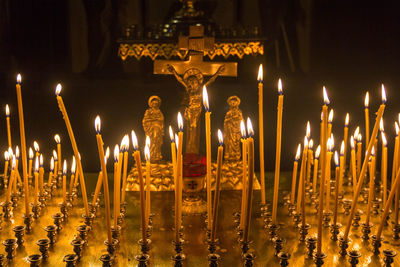 Illuminated candles in church