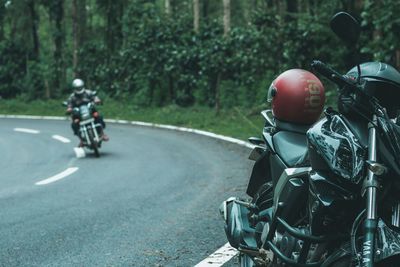 Man riding motorcycle on road