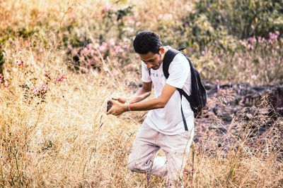 Young man walking on mountain