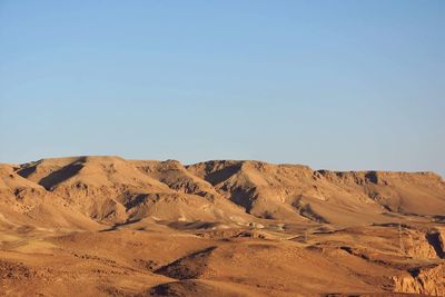 Scenic view of desert against clear sky