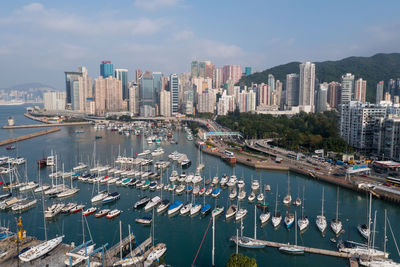 High angle view of marina and buildings against sky