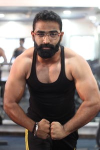 Portrait of muscular man posing in gym