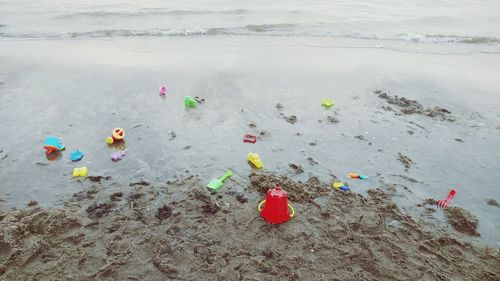High angle view of toys on beach