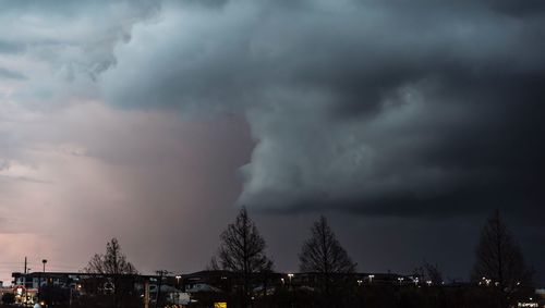 Low angle view of storm clouds over city