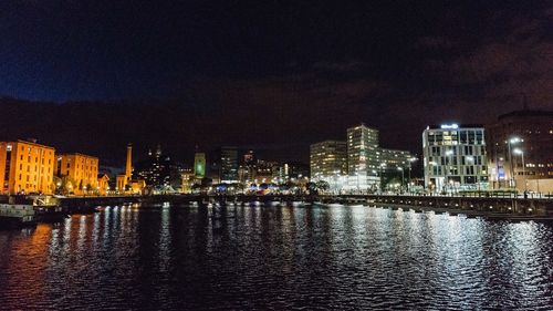 Illuminated city at waterfront