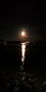 Scenic view of sea against sky at night