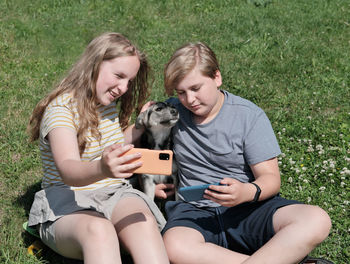 Young couple sitting with dog