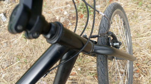 High angle view of bicycle parked on field