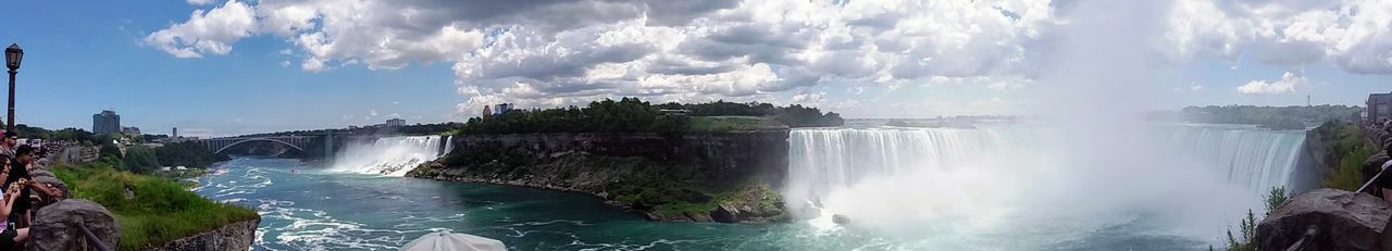 Panoramic view of waterfall against sky