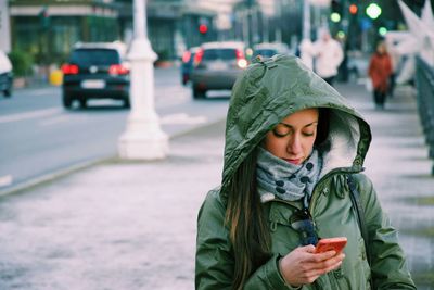 Woman standing on street