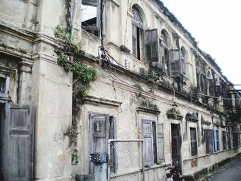 Low angle view of old building in city