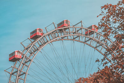 Low angle view of ferris wheel against sky