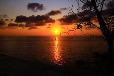 Scenic view of sea against romantic sky at sunset