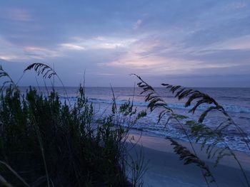 Scenic view of sea against sky at sunset