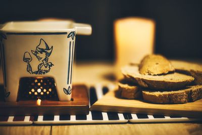 Close-up of fondue set on table