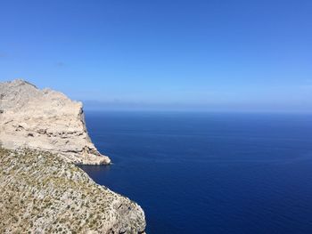 Scenic view of sea against blue sky