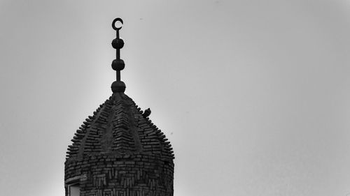 Low angle view of mosque against clear sky